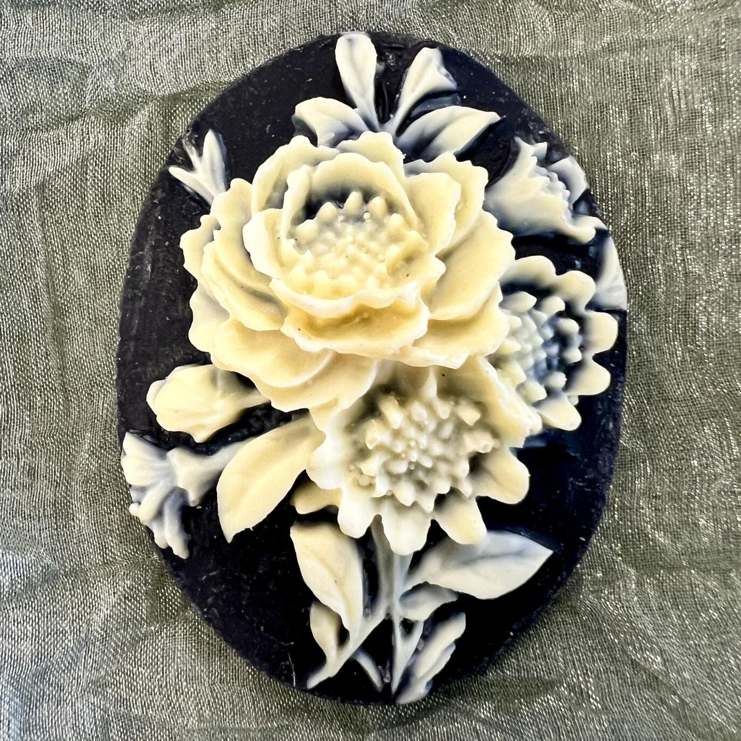 Ivory Floral on Jet 40X30MM Cameo