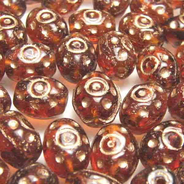 Dark Topaz 9X6MM Oval With Gold Dots And Eye Detail